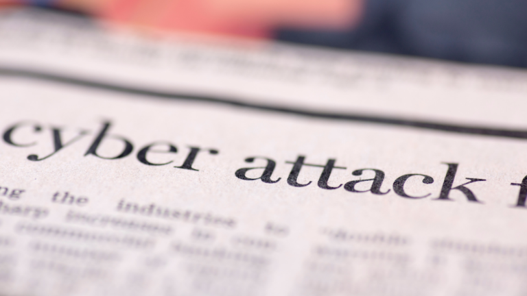 newspaper headline saying cyber attack